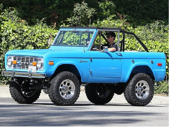 Miles Teller driving his blue Ford Bronco